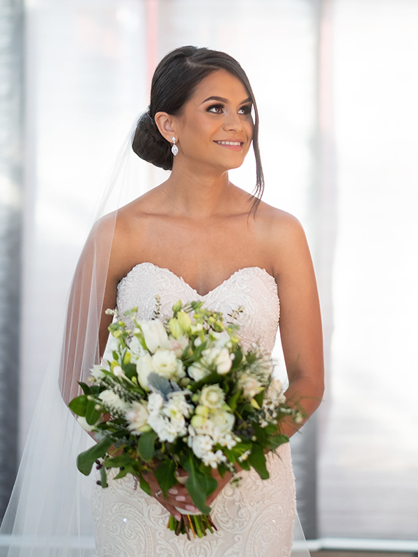 bride holding classic style flowers