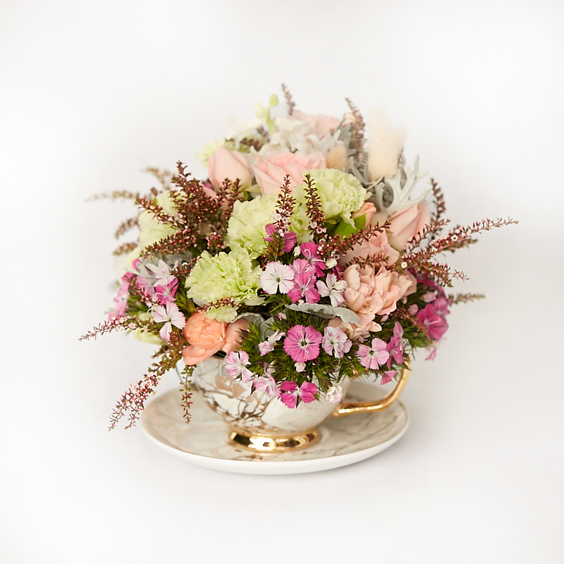 marbled teacup arrangement of flowers